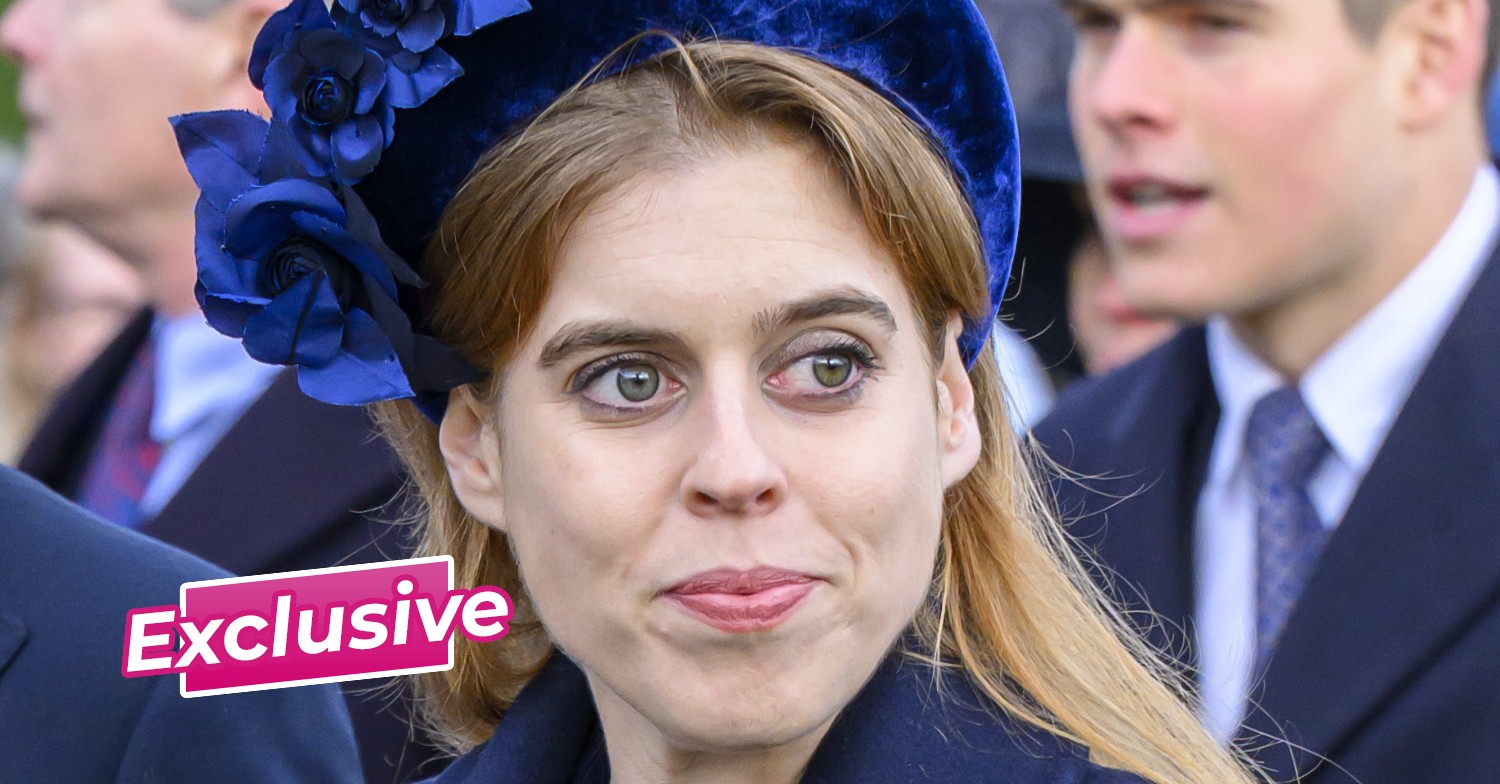 Princess Beatrice in a navy ensemble with hat and jacket with exclusive sticker
