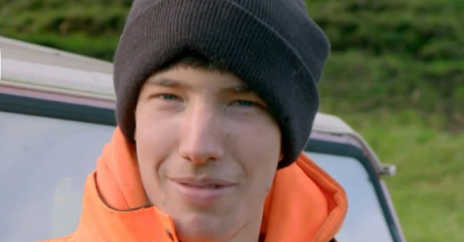 Reuben smiling in a hat