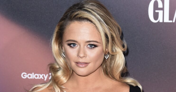 Emily Atack posing at event