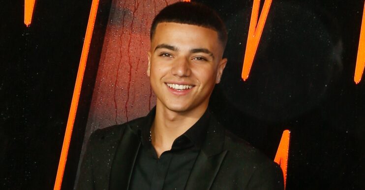 Junior Andre smiling at film premiere