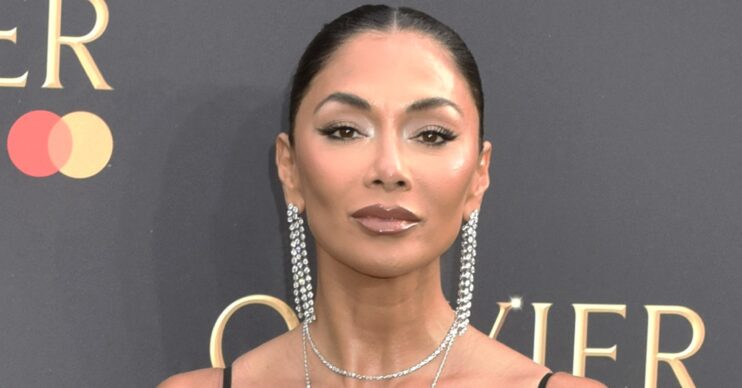 Nicole Scherzinger posing at event