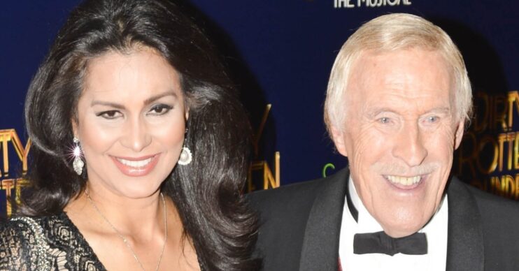 Bruce Forsyth and Wilnelia smiling at a red carpet event