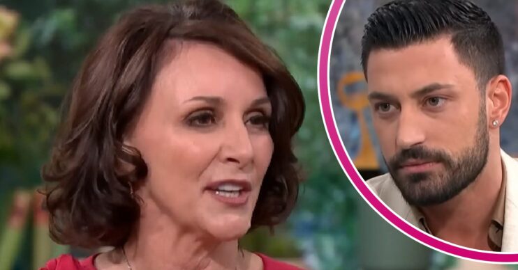 Shirley Ballas talking during an interview beside a frowning Giovanni Pernice