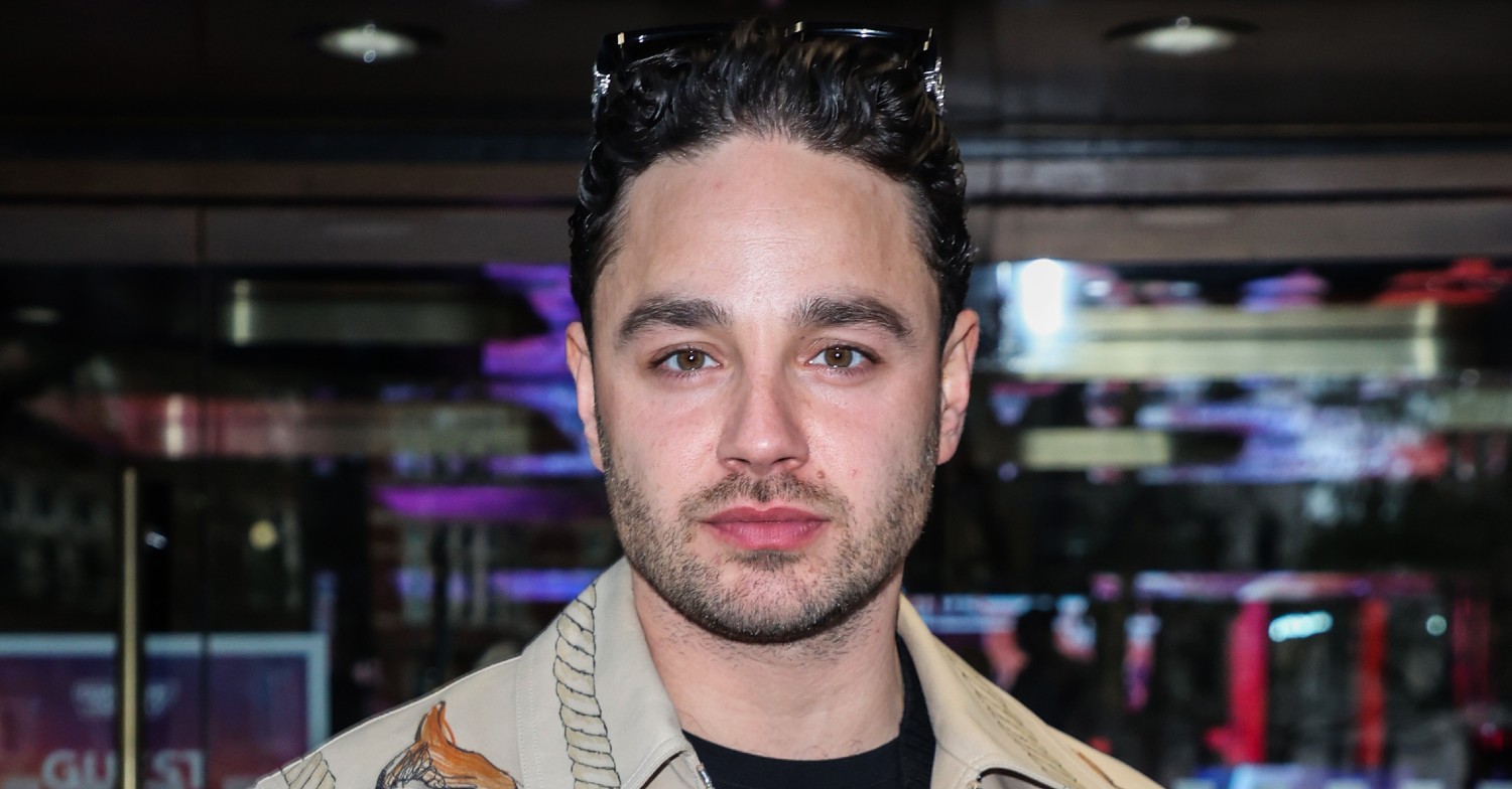 Adam Thomas looking at camera at event