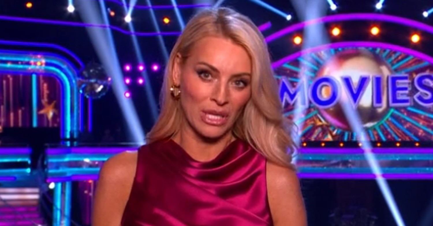 Tess Daly hosting Strictly with serious expression