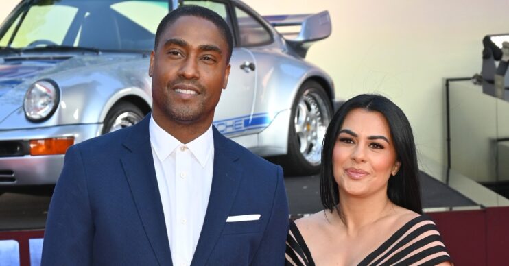 Simon Webbe smiling beside wife Ayshen