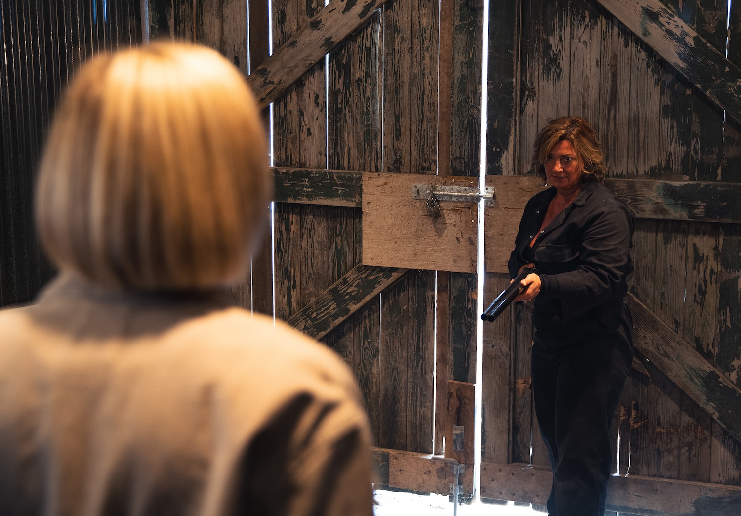 Moira pointing a gun at Ruby on Emmerdale