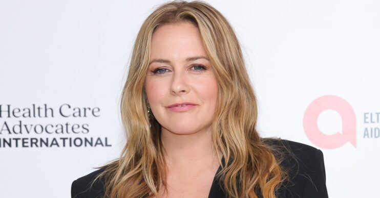 Alicia Silverstone smiling at event