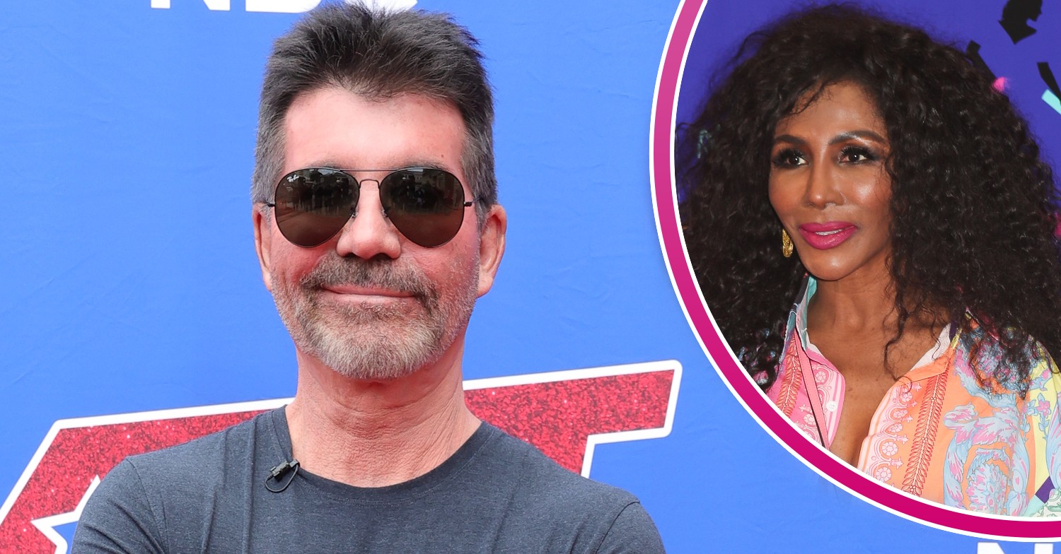 Simon Cowell smiling and Sinitta posing the event