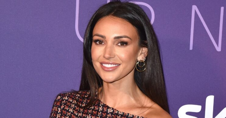 Michelle Keegan smiling at event