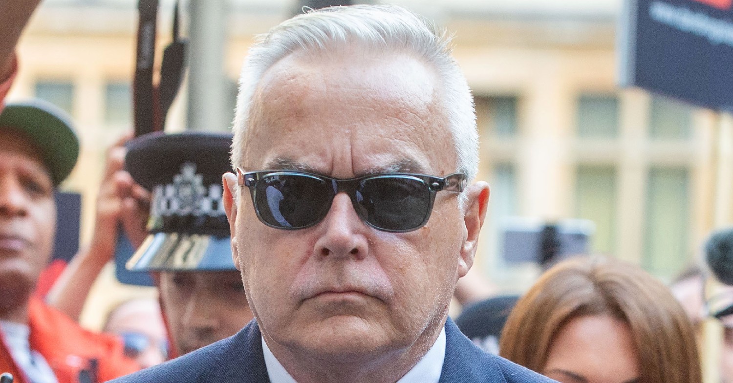 Huw Edwards looking forward, wearing sunglasses