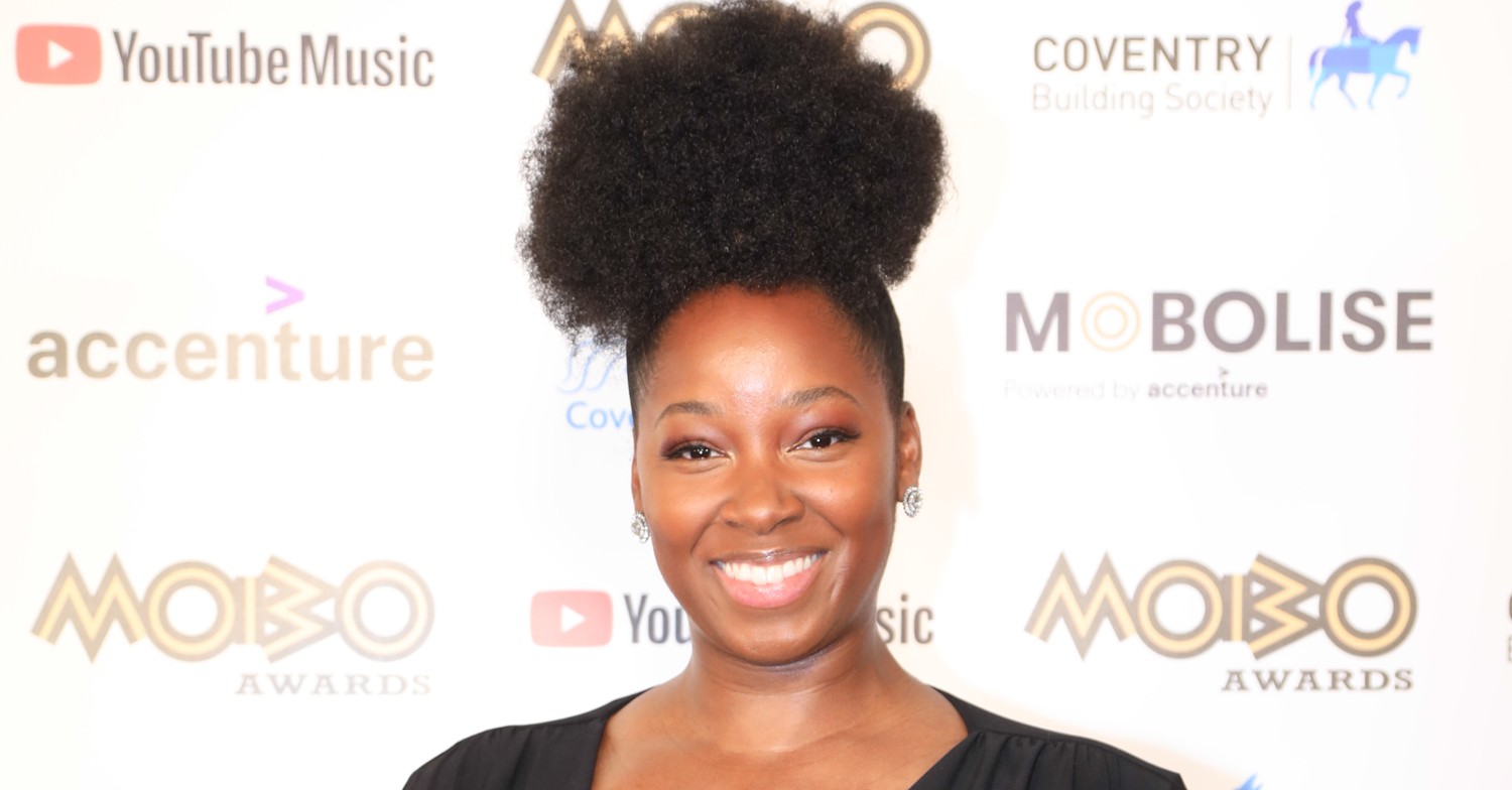 Jamelia beaming with -up-do hairstyle