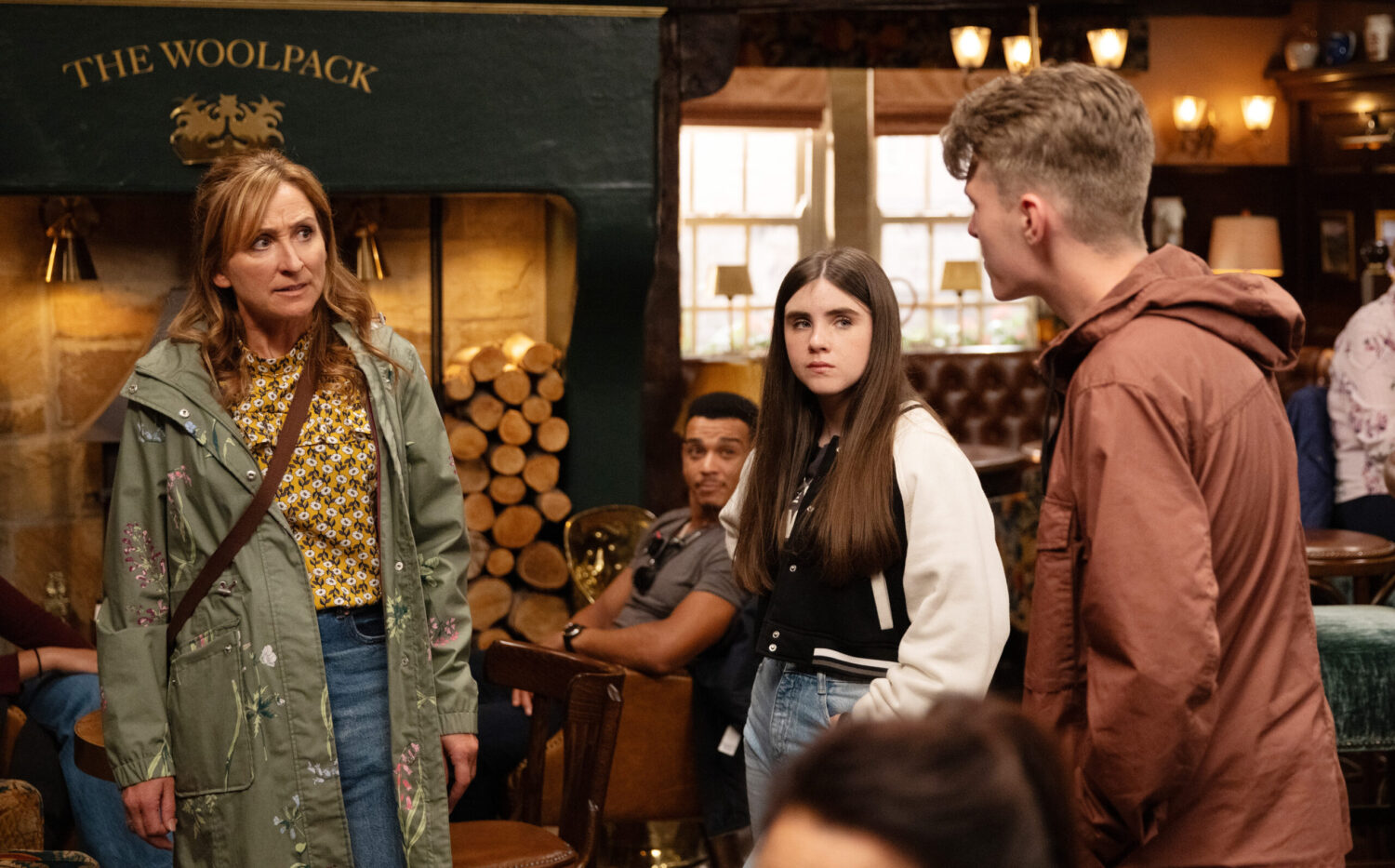 Laurel angrily talks to Arthur as April looks on in Emmerdale