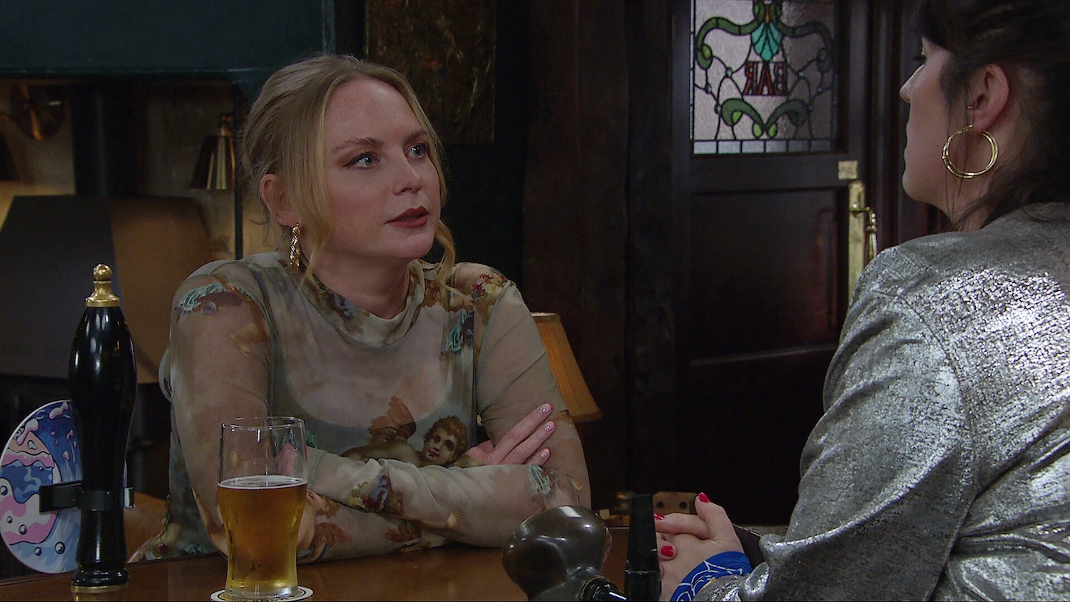 Emmerdale's Amy is talking to Kerry in the Woolpack
