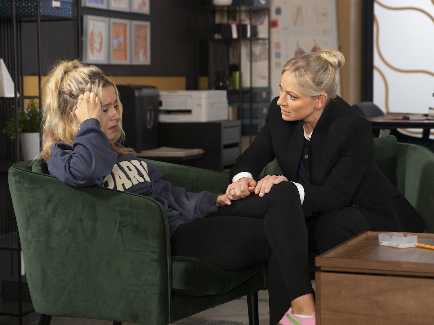 Betsy is confiding in Lisa at the factory
