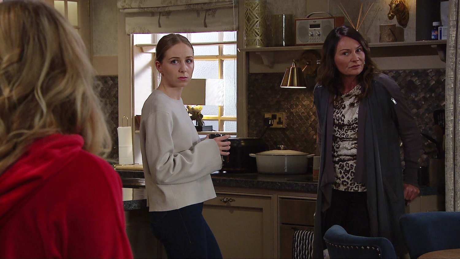 Belle and Chas are staring at Amelia in the back room of the pub