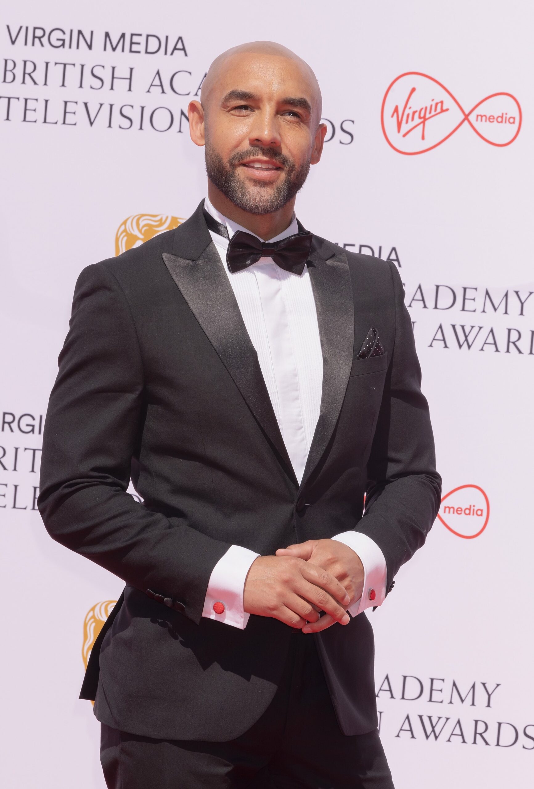 Alex Beresford smiling at the BAFTAs