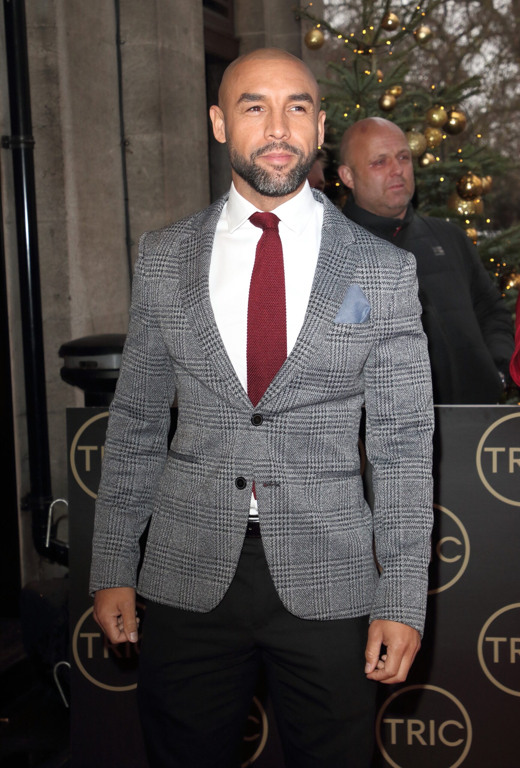 Alex Beresford smiling at the TRIC Awards
