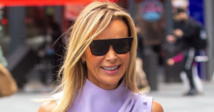 Amanda Holden smiling with sunglasses on outside Heart Radio