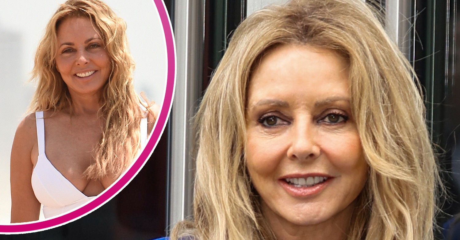 Carol Vorderman in a white swimsuit and blue jumpsuit