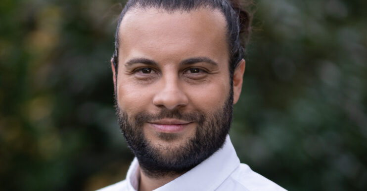 EastEnders' Chris Clenshaw is smiling