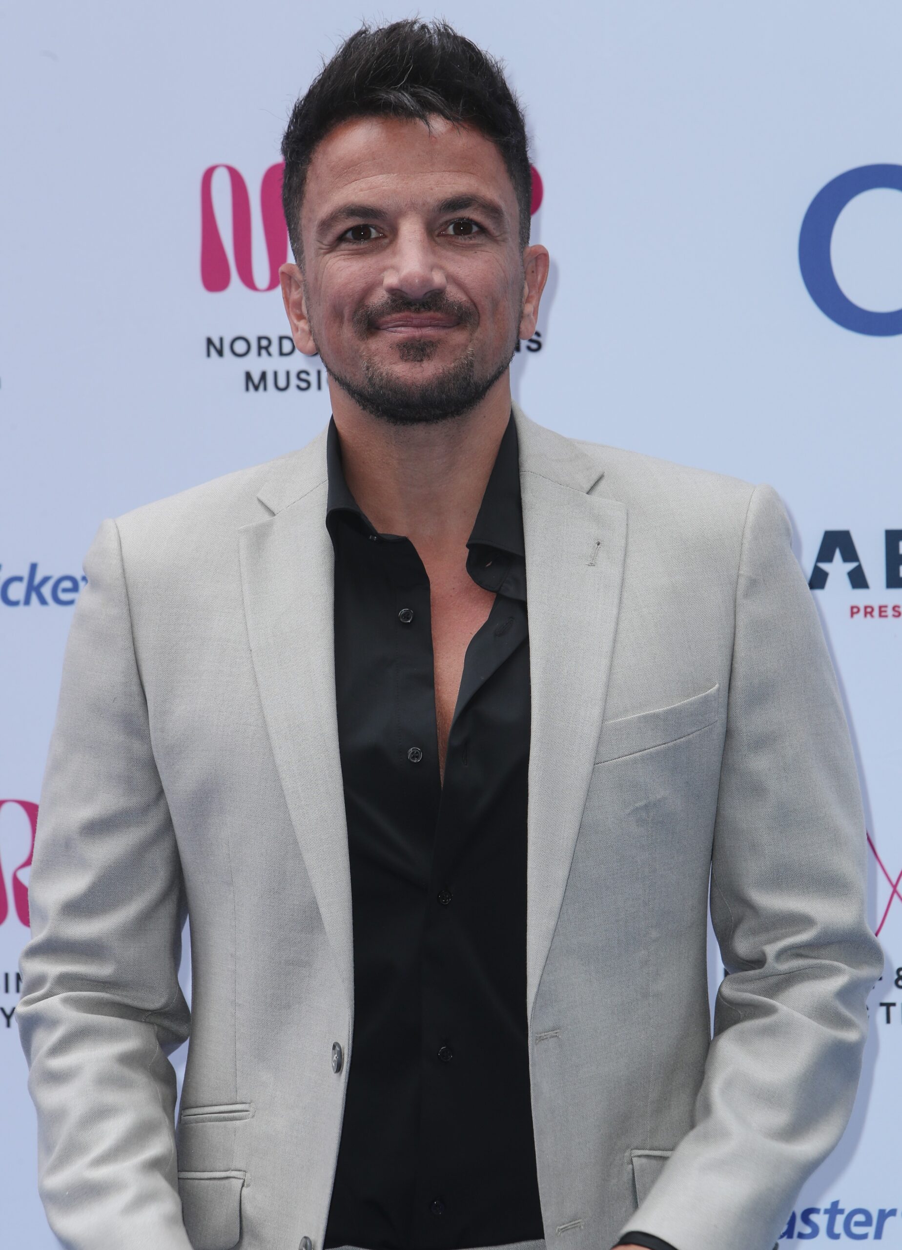 Peter Andre smiling at event