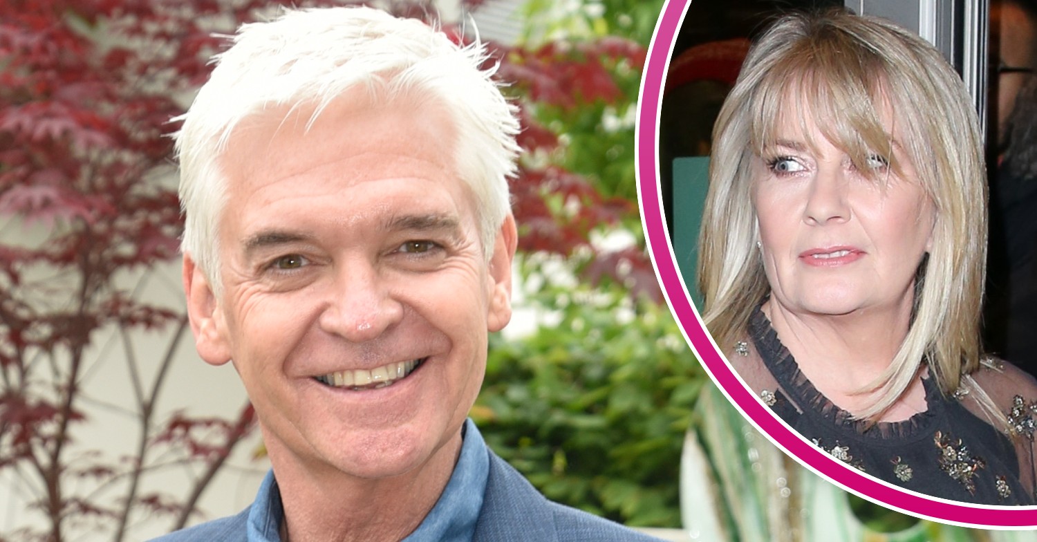 Phillip Schofield smiling at Chelsea Flower Show and wife Stephanie at event