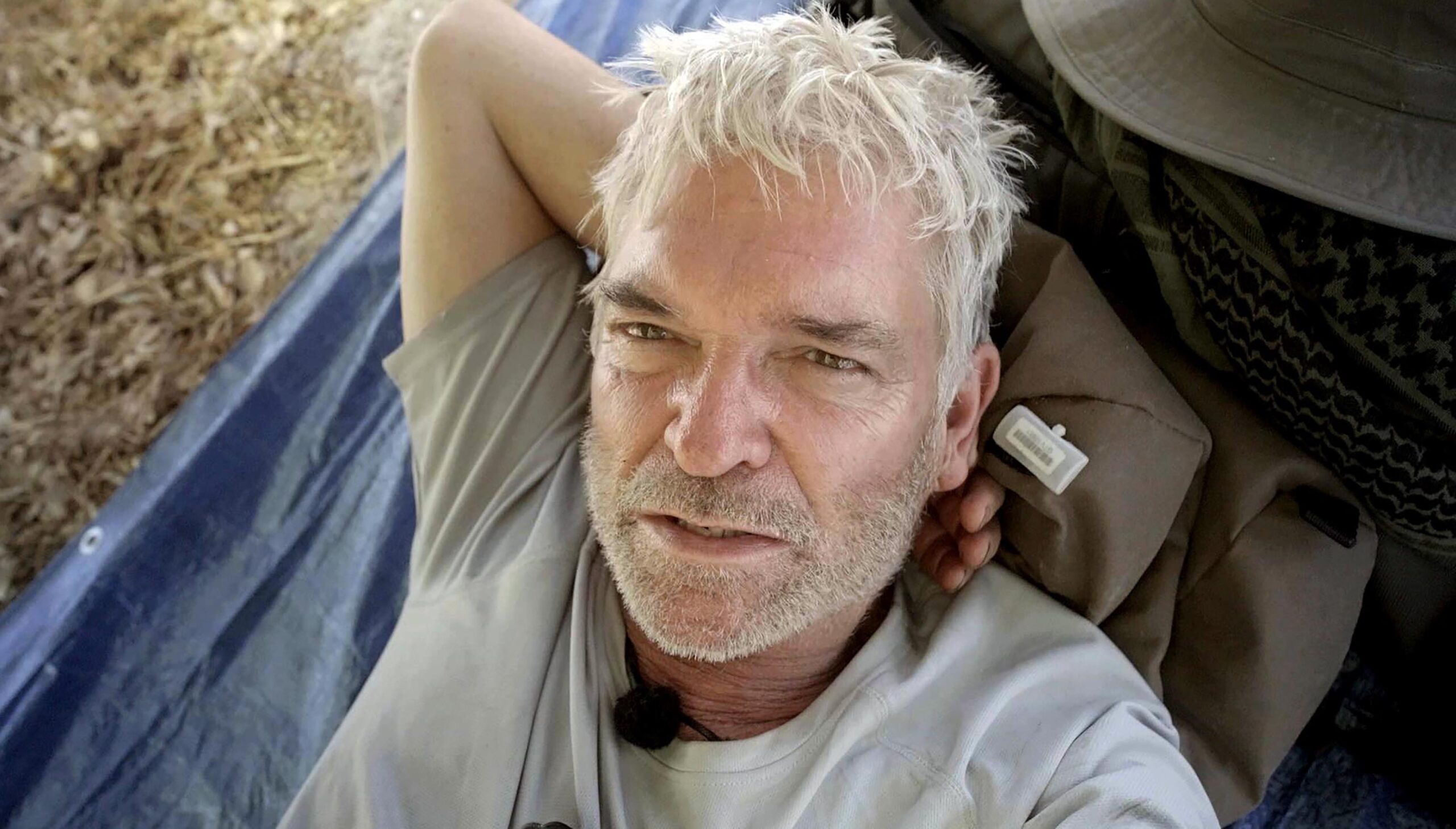 Phillip Schofield with his arm behind his head on Channel 5 show Cast Away