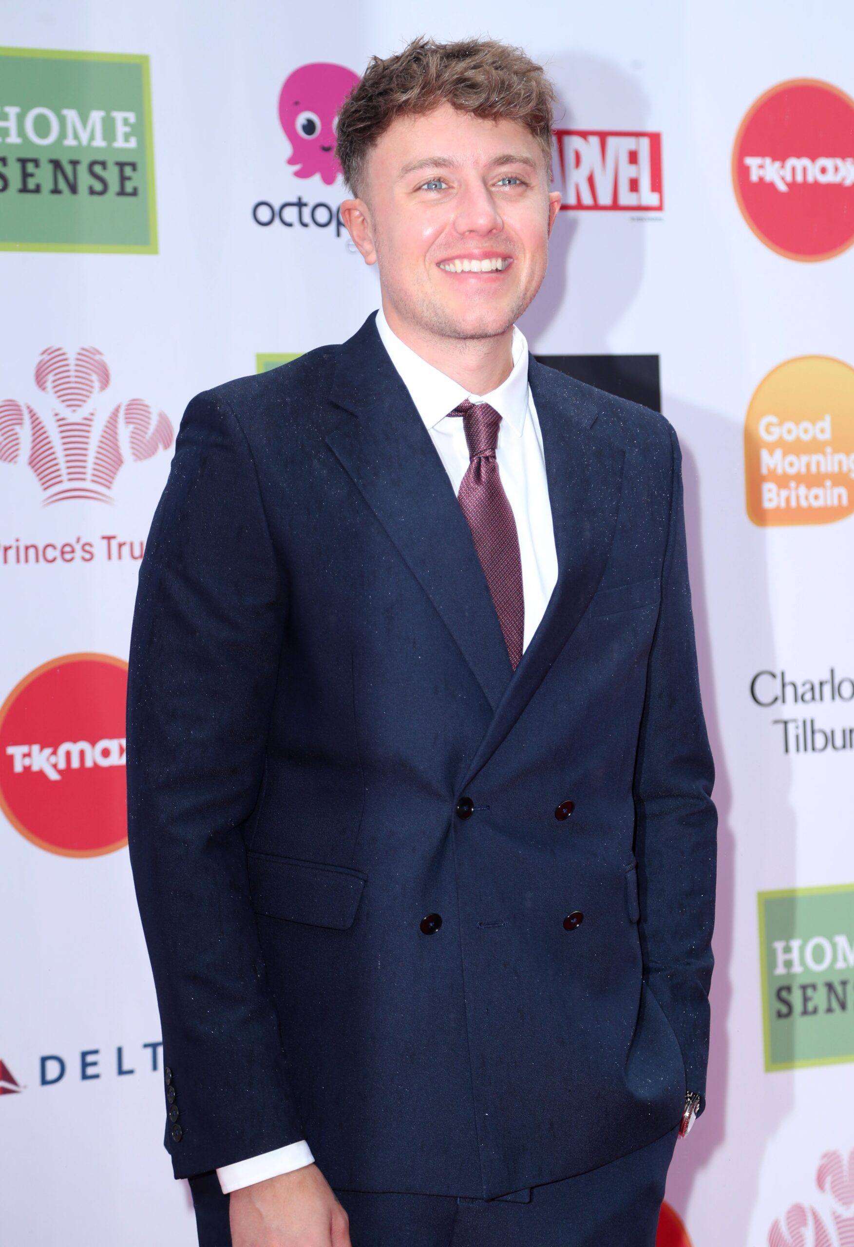 Roman Kemp smiling at event