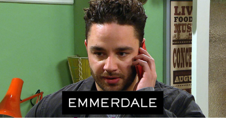 Adam Barton on Emmerdale with logo