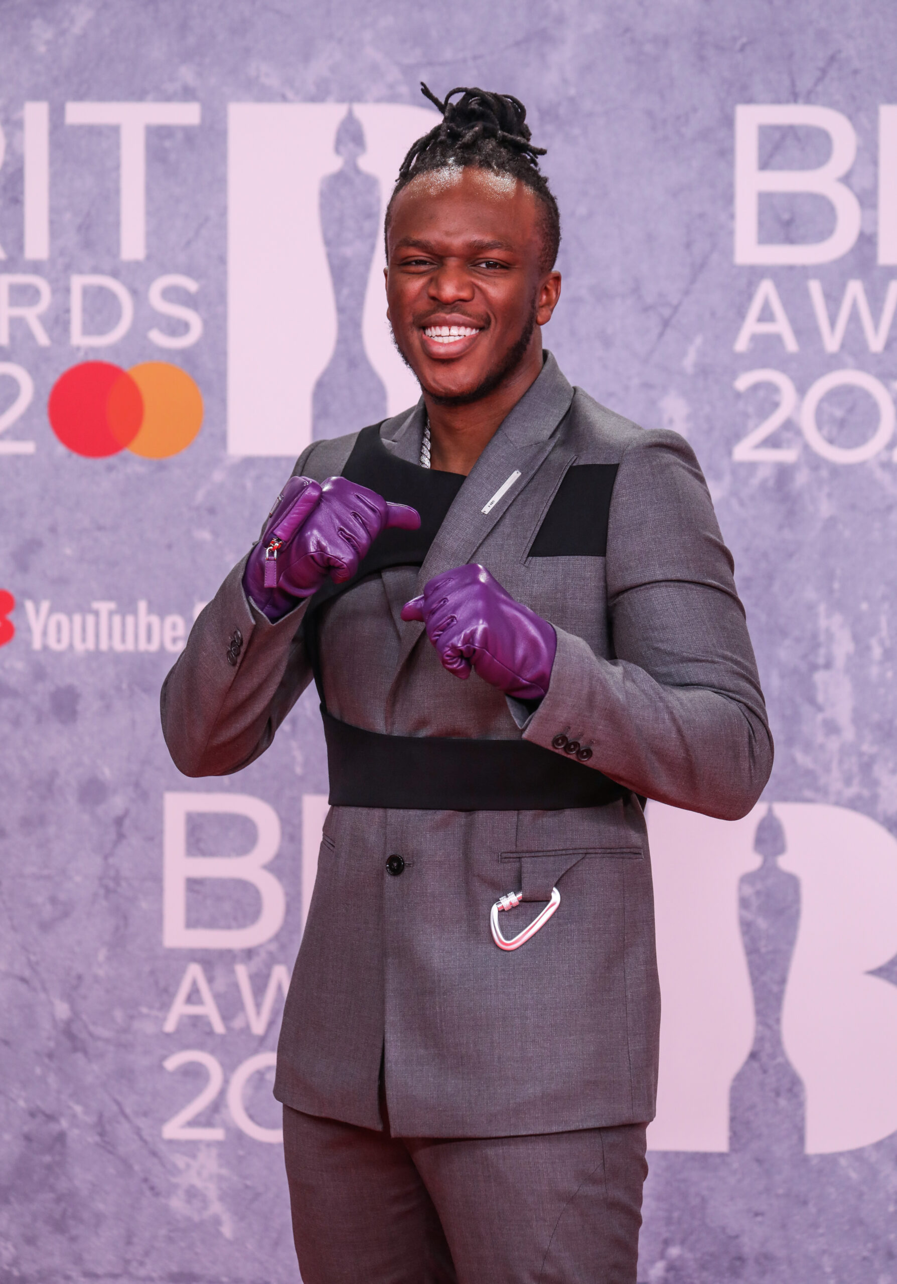 KSI pretending to throw punches on the BRITs red carpet