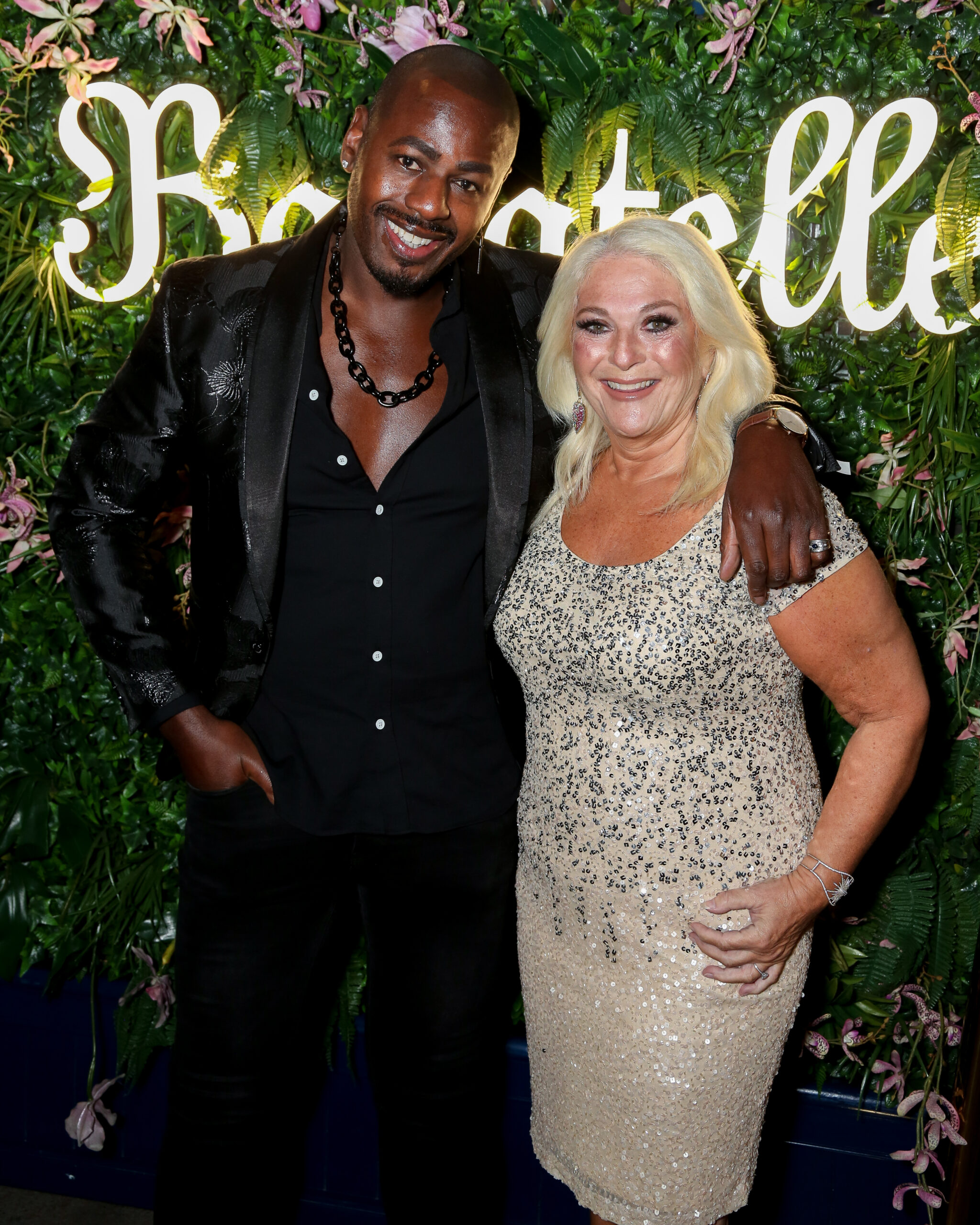 Vanessa Feltz and Ben posing on a red carpet 