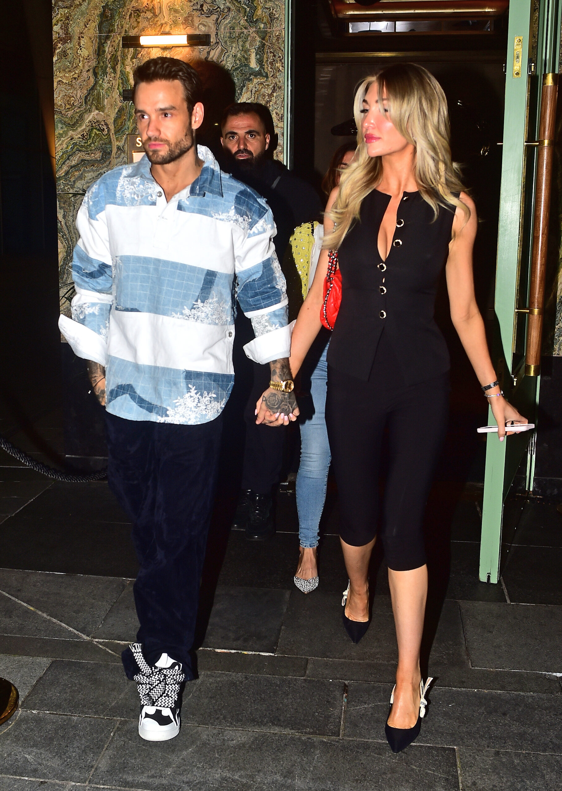 Liam Payne and Kate Cassidy holding hands