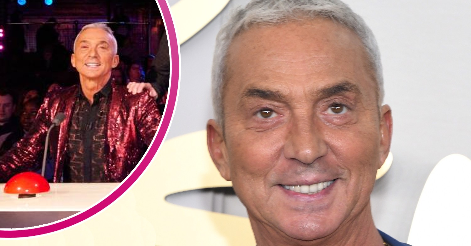 Bruno Tonioli smiling and sitting on his BGT desk