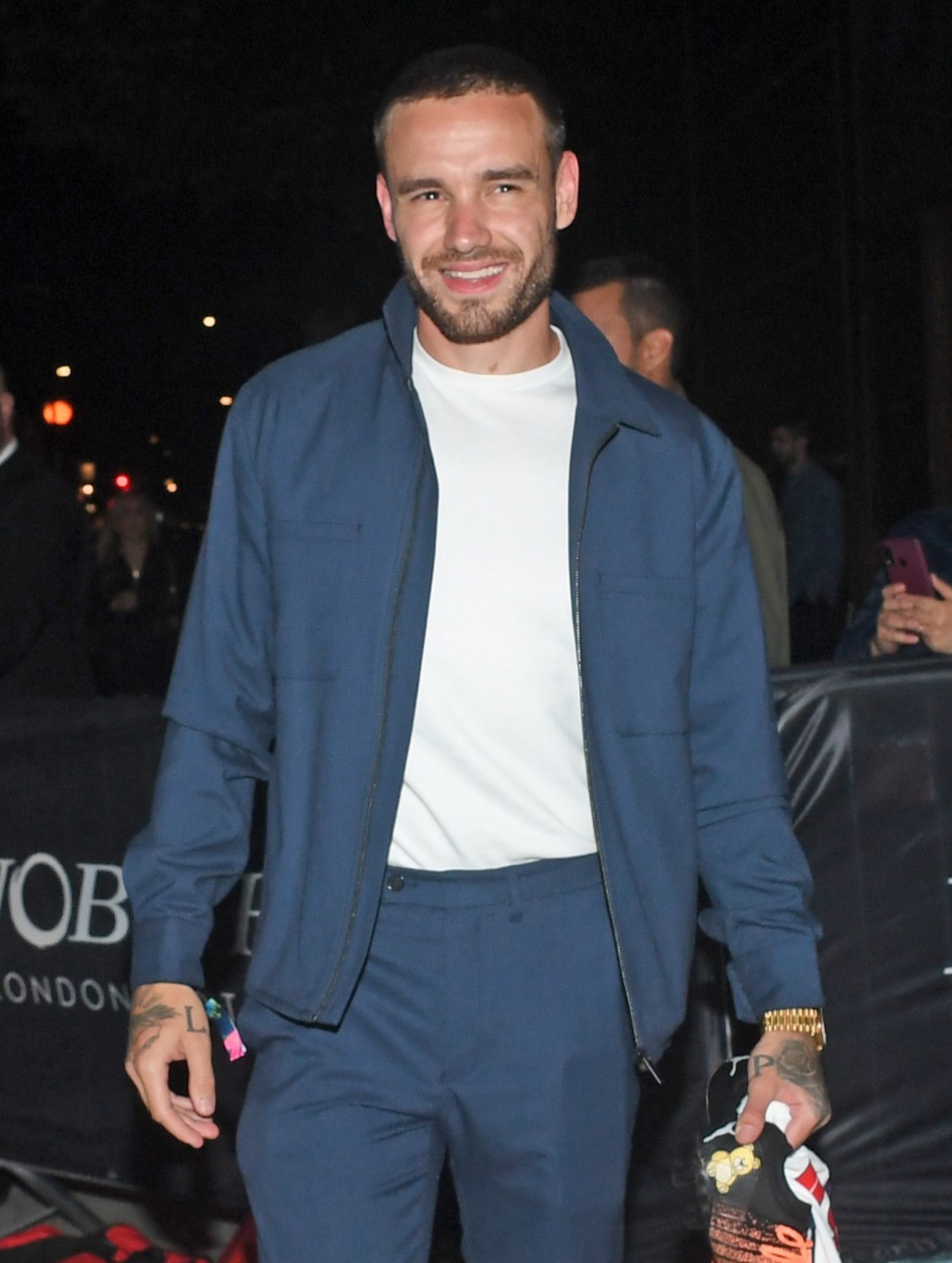 Liam Payne smiling in blue outfit