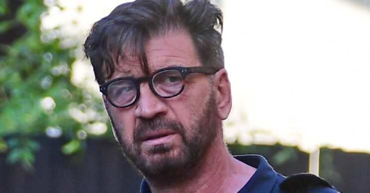 Nick Knowles looking worried wearing glasses