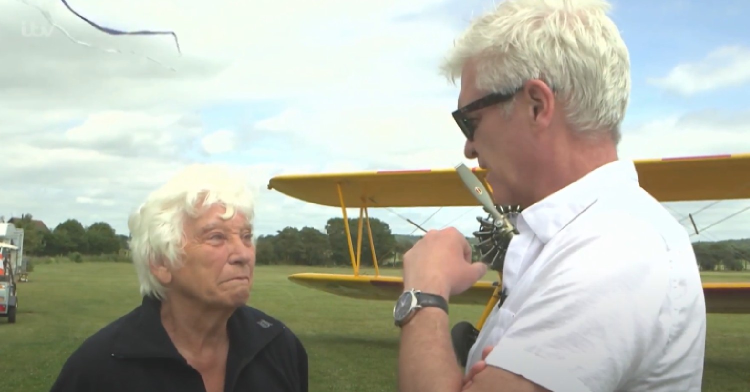 Phillip Schofield and his mum talking on This Morning beside a plane