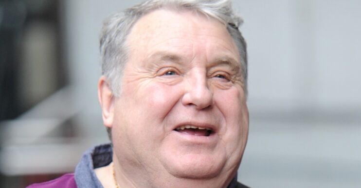 Russell Grant smiling in the street