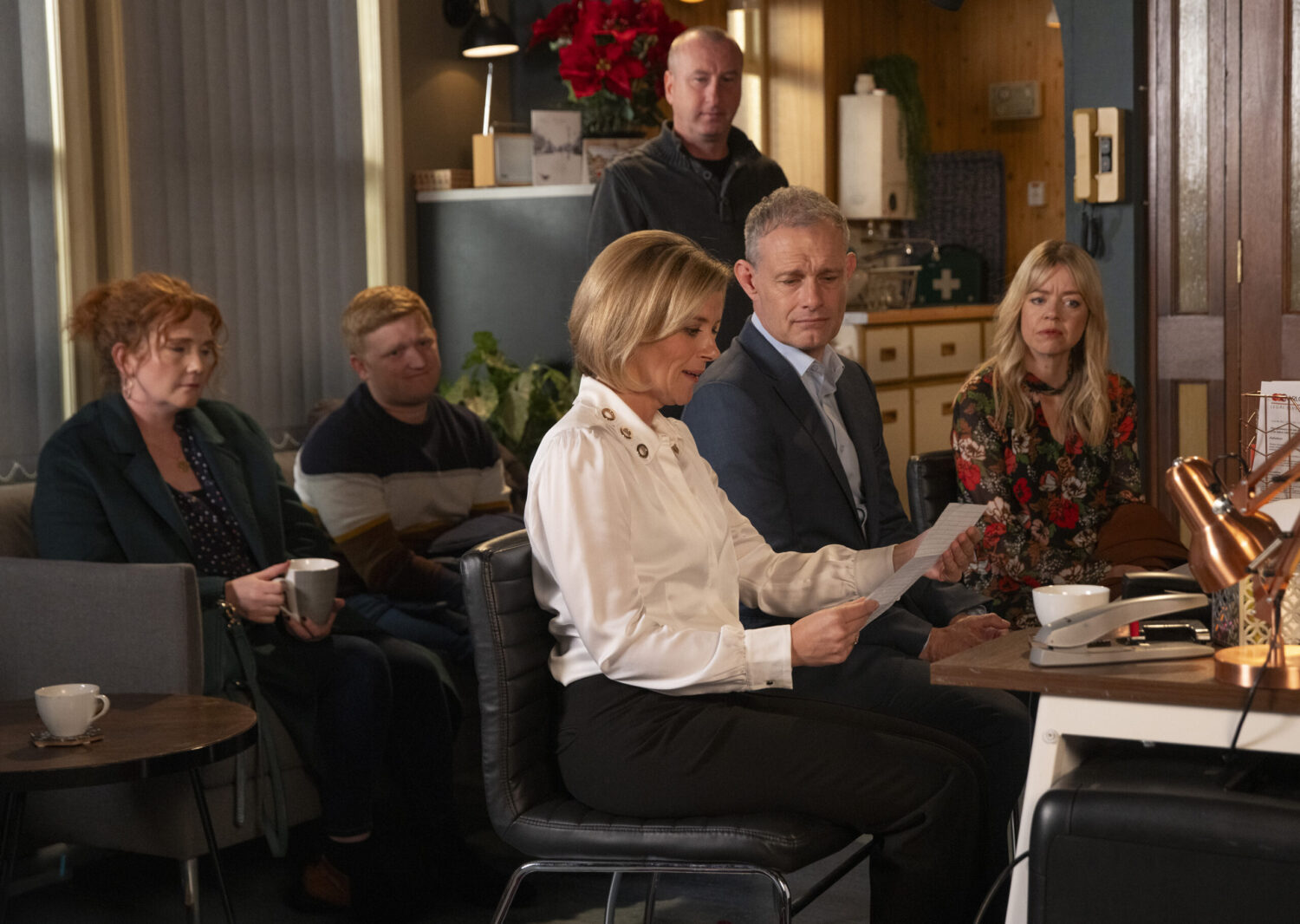 Leanne and family reading a letter