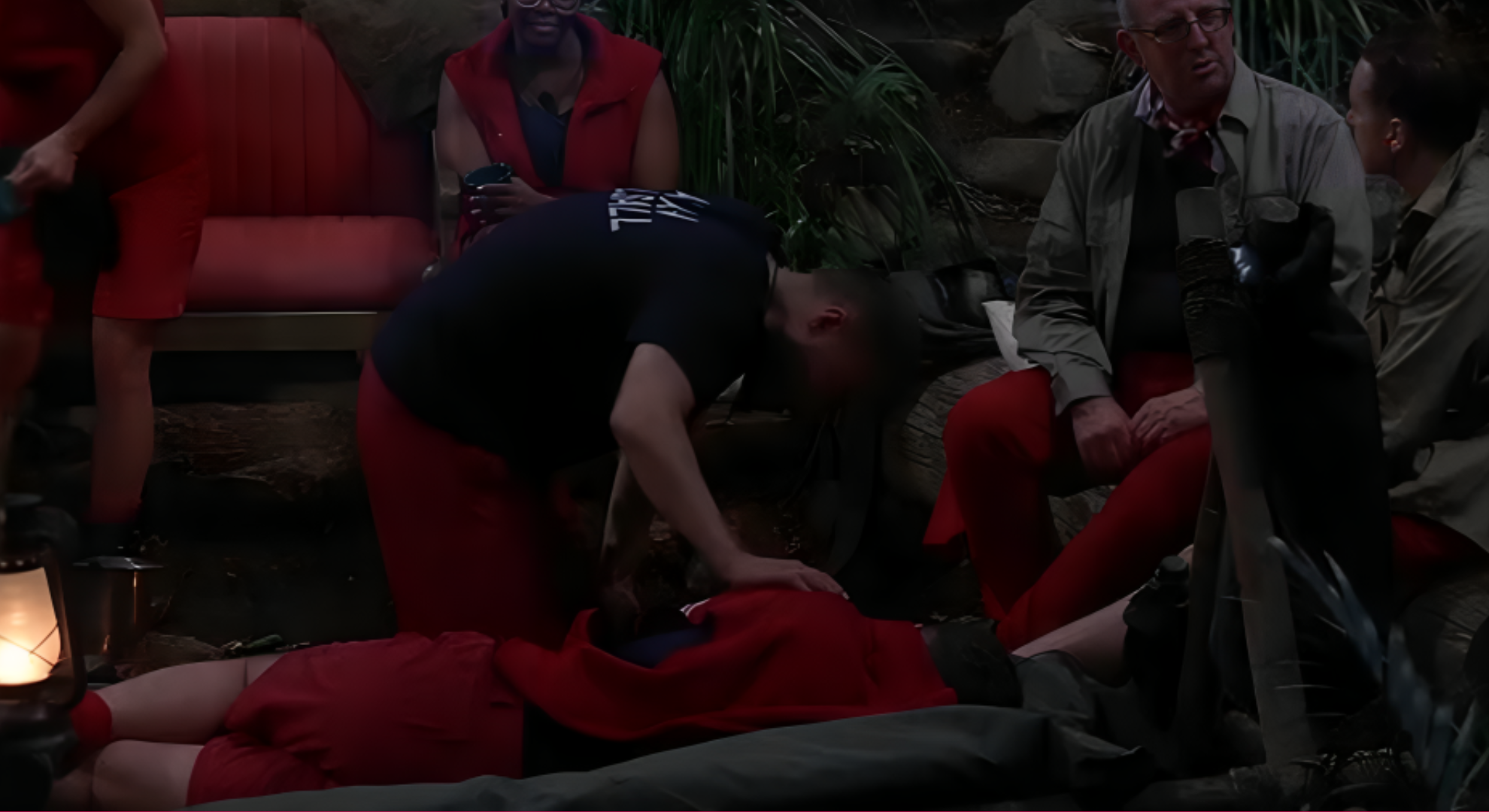 Alan Halsall is trying to wake up Dean McCullough on I'm a Celebrity.