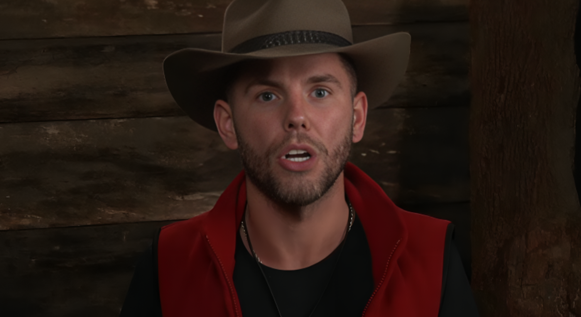 Dean McCullough is seen in a close up looking angrily at the camera on I'm a Celebrity