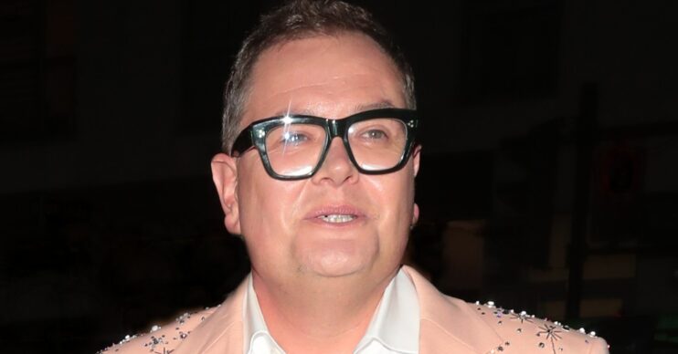 Alan Carr on a night out wearing glasses