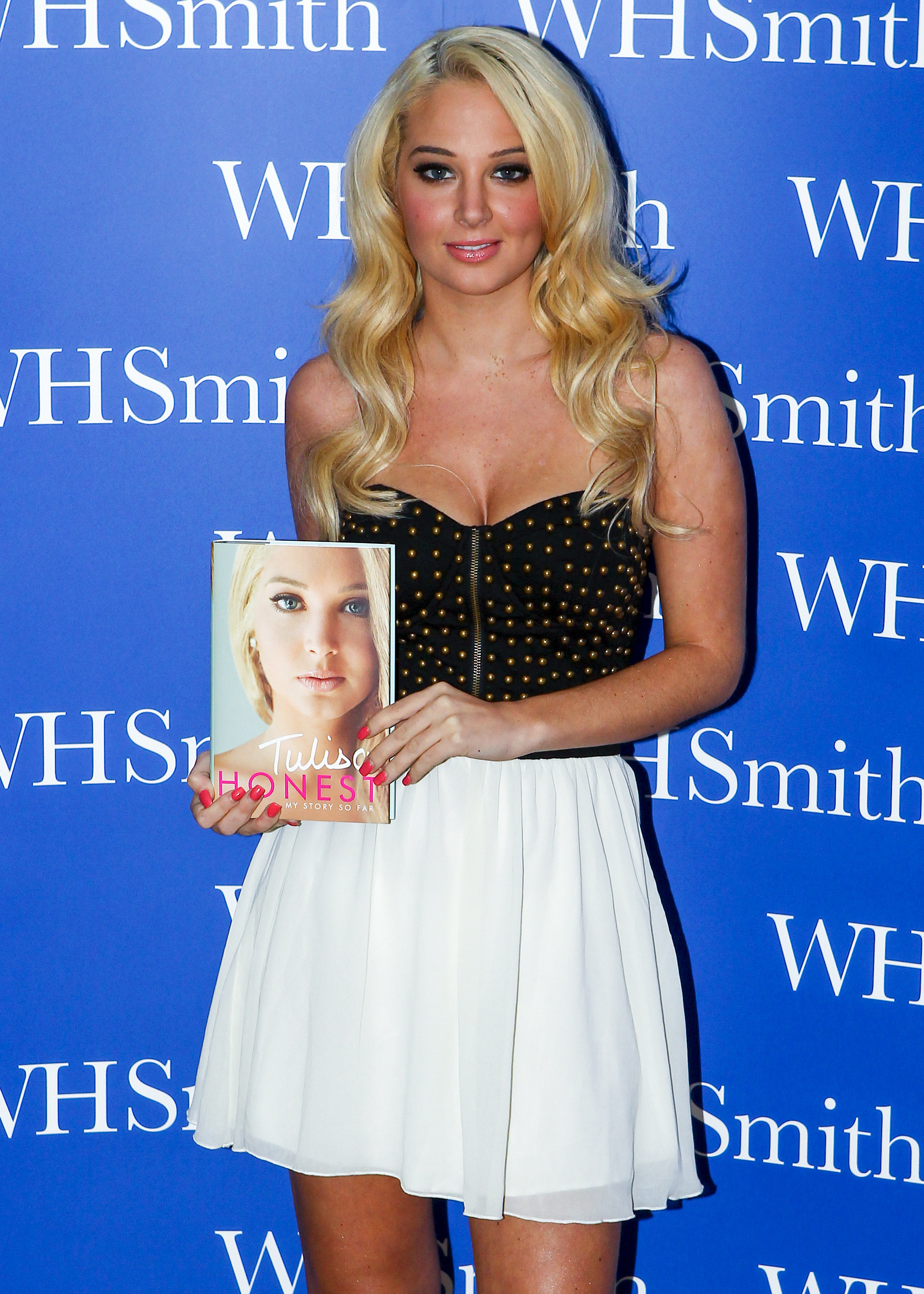 I'm A Celebrity star Tulisa Contostavlos posing with her book