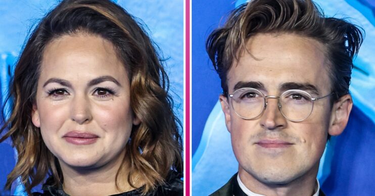 Giovanna and Tom Fletcher standing against a blue background