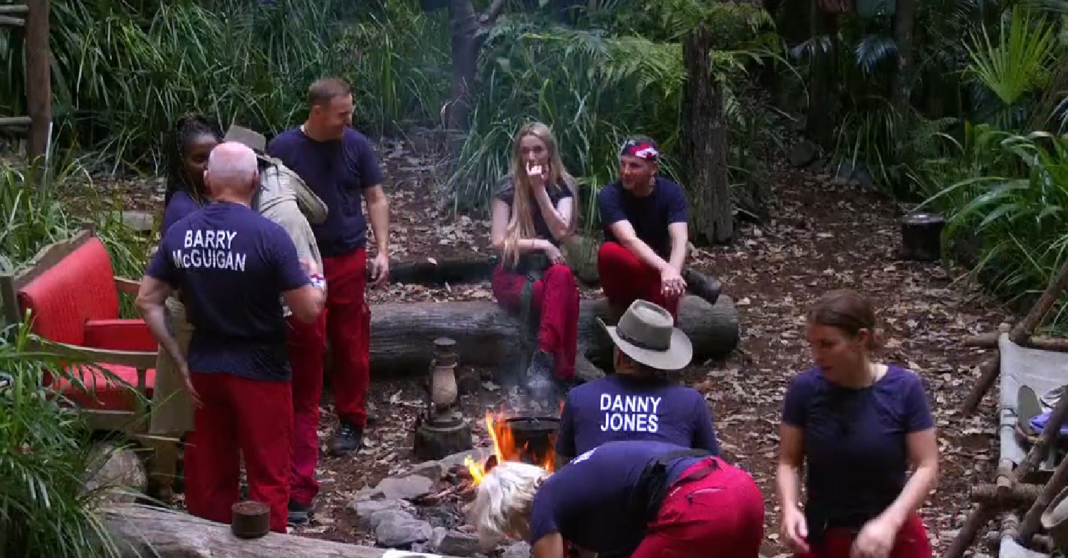 I'm A Celebrity 2024 stars sat around fire