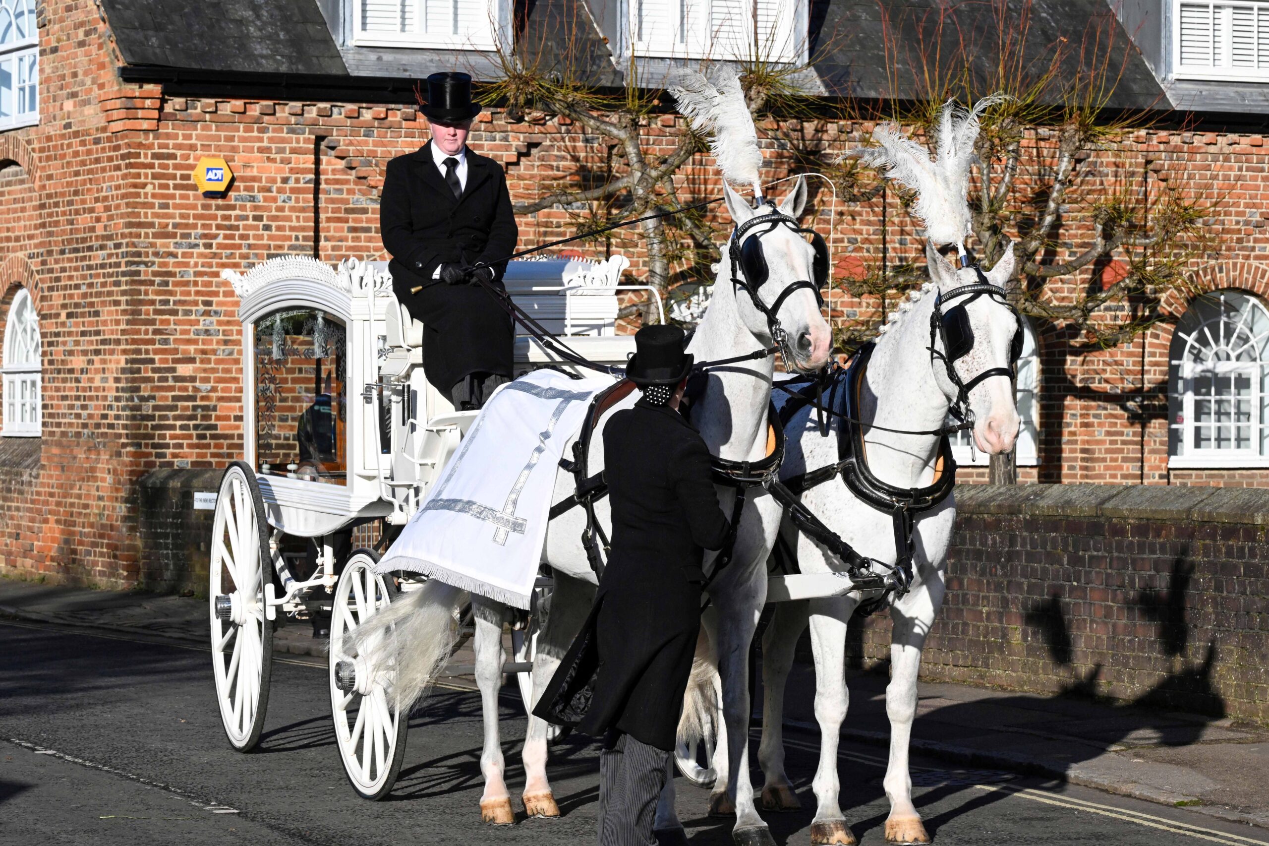 Liam Payne's coffin being carried in a horse-drawn carriage at his funeral