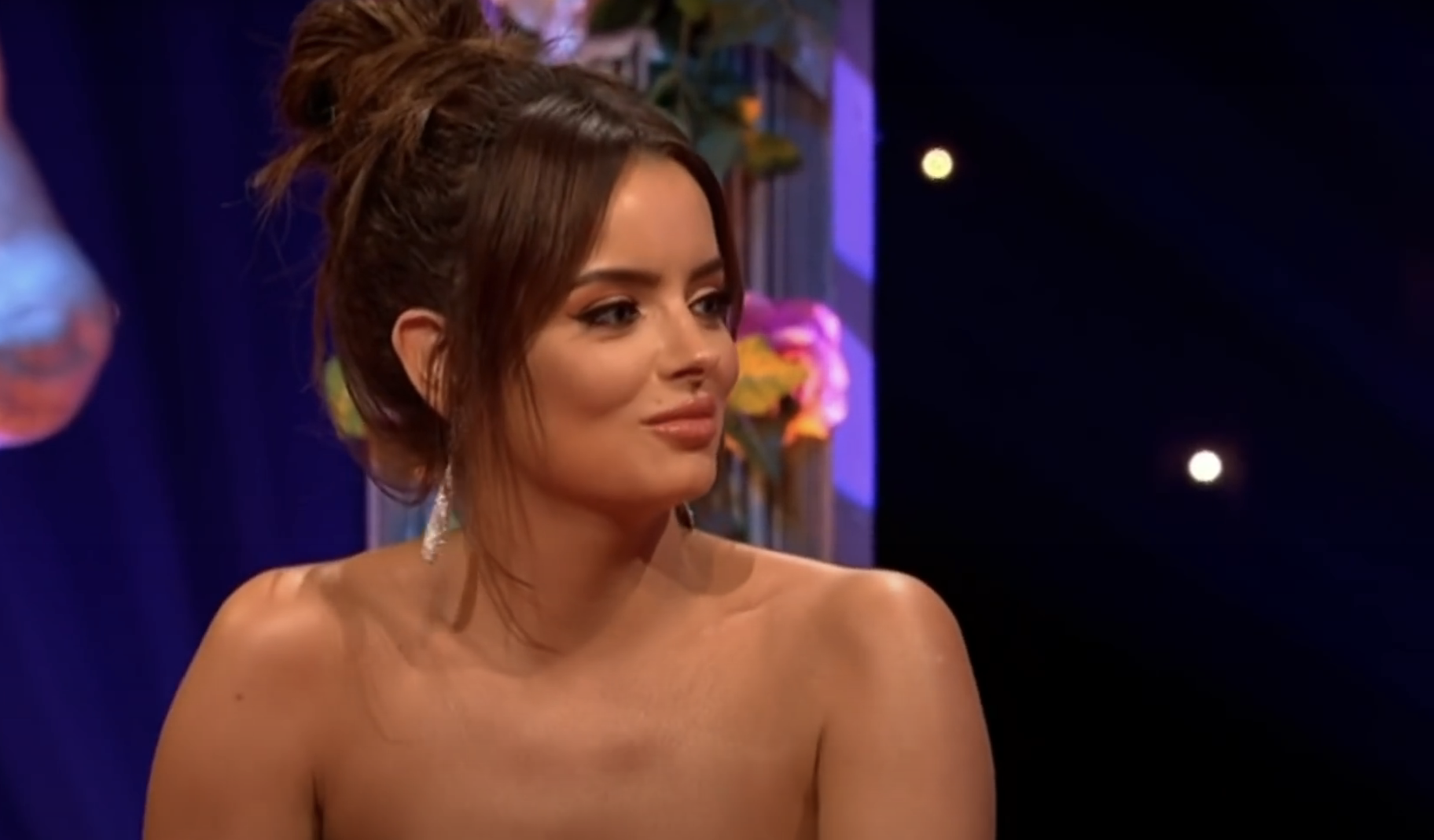 Maura Higgins with her hair up on a TV panel show