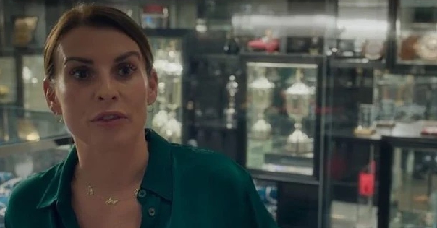 Coleen in Wayne's trophy room