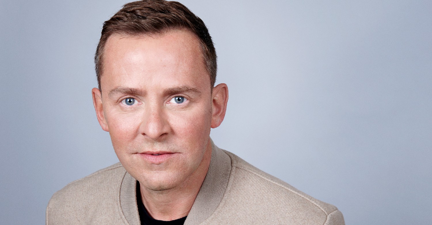 Scott Mills looking at the camera in a promo pic 