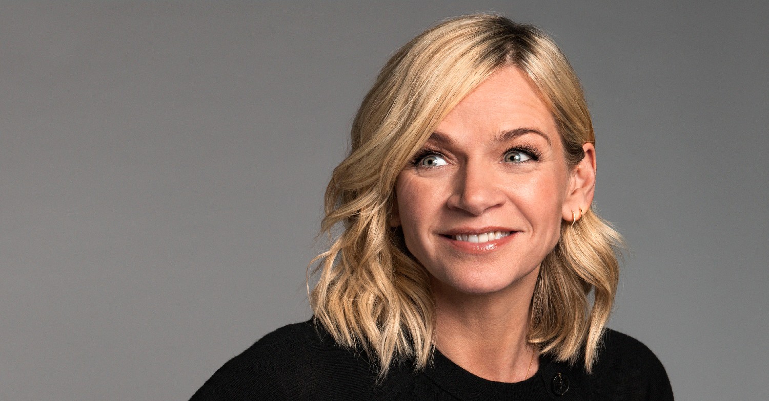 Zoe Ball smiling and looking to the side
